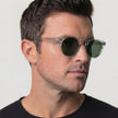 Men's polarized sunglasses from FJØRNA with glare-reducing lenses, suitable for outdoor activities, shown in a close-up image.