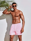 Men's striped regular fit swim shorts by FJØRNA, featuring a vibrant summer design, perfect for beach and pool outings.