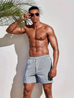 Men's striped FJØRNA swim shorts with a regular fit, featuring a colorful striped pattern, ideal for summer beach or pool days.