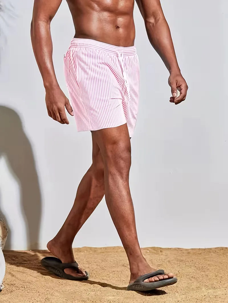 Men's striped FJØRNA swim shorts with a regular fit, featuring a colorful striped pattern, designed for summer beachwear.